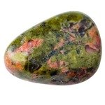 natural mineral gem stone - specimen of Unakite gemstone isolated on white background close up